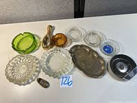 Group shot of all ashtrays and metal scoop laid out