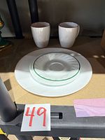 Dinner plate, salad plate with green rim, two red-rim mugs
