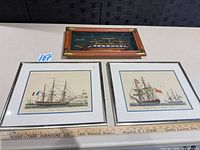 Overall lot: two ship prints in silver frames and USS Constitution shadow box