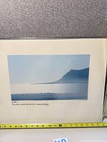 John Chang McCurdy seascape photograph in silver frame with measuring tape