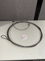 Coiled galvanized steel wire rope on table