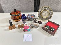 All twelve miniature decorative items grouped