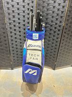 Front view of Mizuno Tech Van golf bag loaded with loose shafts