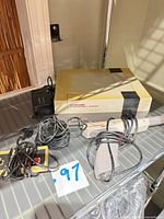 Console with wired accessories on shelf