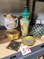 Group shot showing all seven porcelain and gilt items