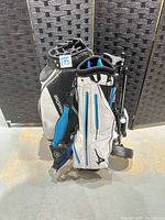Two golf bags on folding push cart