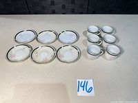Full set: six saucers and six cups displayed
