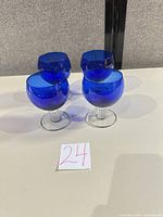 Group shot of four cobalt blue goblets