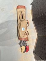 Canvas/leather carry bag with clubs and headcovers
