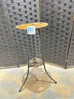 Full view of cast iron plant stand showing overall design and condition