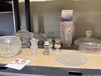 Shelf view showing majority of glass and crystal items