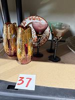 Front view of two Bohemian vases, Spode plate, three cordial glasses