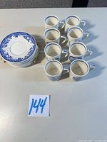 Stack of 8 saucers and 8 matching demitasse cups