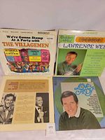 Group shot of four LPs: The Villagemen, Lawrence Welk, Frank Sinatra, Andy Williams
