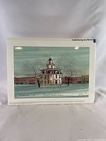 Full view of signed numbered print with courthouse illustration and visible signature/edition