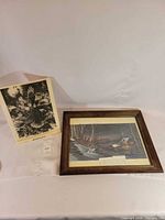 Two items: framed winter cabin print and bird plaque