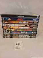 Stacked spines showing all nine DVD titles