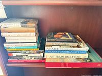Two stacks of books on shelf