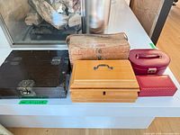 Group shot of five visible boxes on ledge