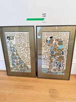 Both framed Klimt prints side by side