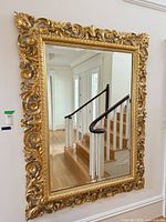 full view of gilded mirror on wall