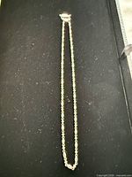 Full view of sterling chain laid flat