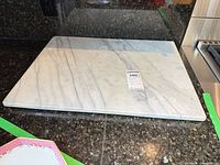 Full view of marble cutting board on countertop