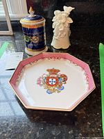 Group shot showing Porart jar with lid, Porart dish and musical figurine