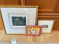 All three framed artworks together