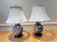 pair of ceramic floral table lamps with white shades