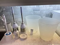 Full lot view showing brushes, bins, soap items
