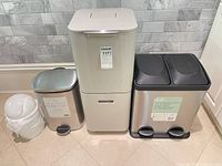 All four waste bins side by side showing relative sizes and styles