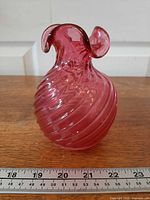 Front view showing full vase, ruler indicates size