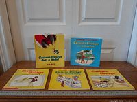 All five Curious George books front covers visible