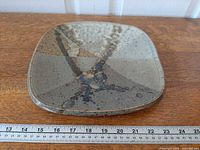 Top view of square stoneware plate with abstract glaze