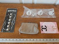 All four items laid out with ruler for scale