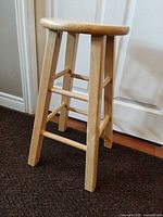 Full view of stool angle showing legs and stretchers