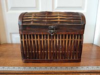 Front view showing woven rattan sides, metal latch, overall size reference