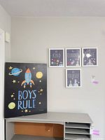 Canvas and framed prints hanging on wall