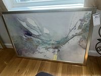 Front view of abstract wall art in metallic frame