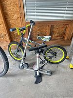Schwinn kids bike, Razor scooter and Schwinn pump grouped together
