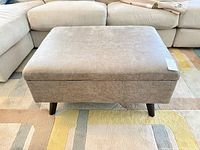 Closed ottoman front view on rug