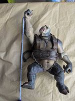 Full body of figure with tape showing height