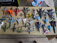Overview of all toy aircraft laid out on table