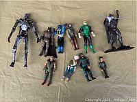 Group shot of all action figures laid out on fabric