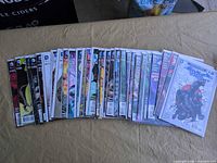 All comics laid out fanned to show spines and quantity