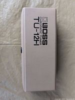 Boss TU-12H tuner top view showing branding