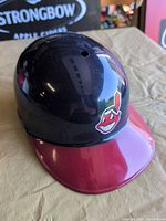 Front/left view showing Chief Wahoo logo and maroon brim