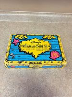 Box top showing Disney's Mermaid Sirene Golden Toy Set graphics