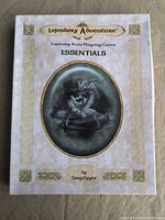 Front view of Lejendary Adventure Essentials boxed set showing title and dragon artwork